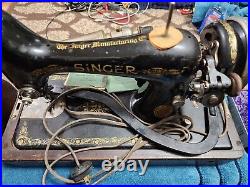 Singer 99 Sewing Machine with instructions, parts, knee control, lamp